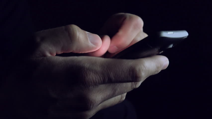 close up of hands holding a mobile phone