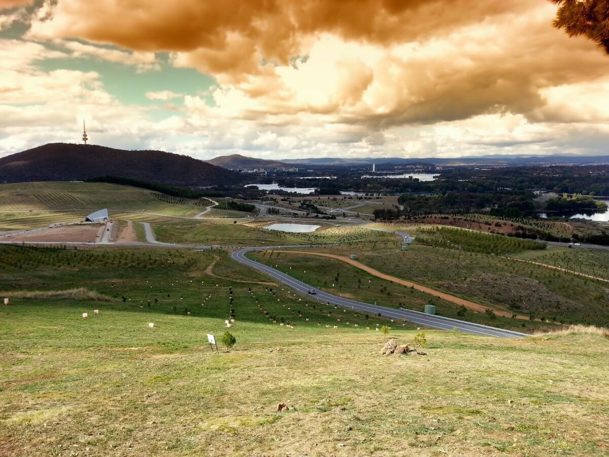 A view of Canberra's landscape, looking towards the city from the National Arboretum. Black Mountain Tower is visible in the background.