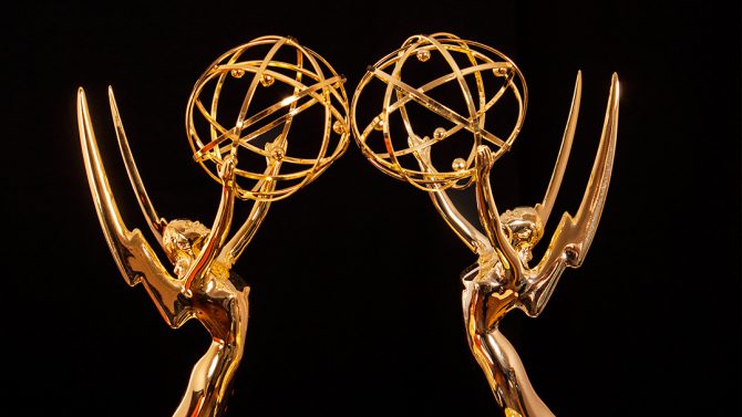 two emmy awards facing each other