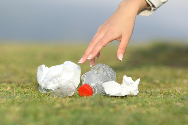 hand picking up litter