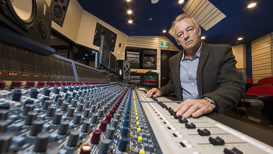 Mark Opitz sitting in front of sound board