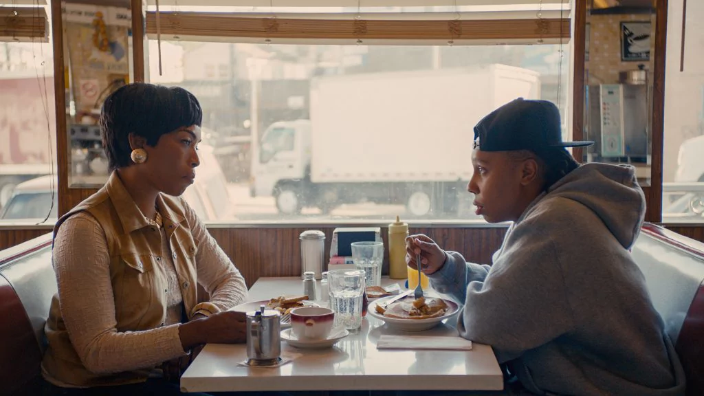 Densie from master of none, sitting across form her mother at a diner