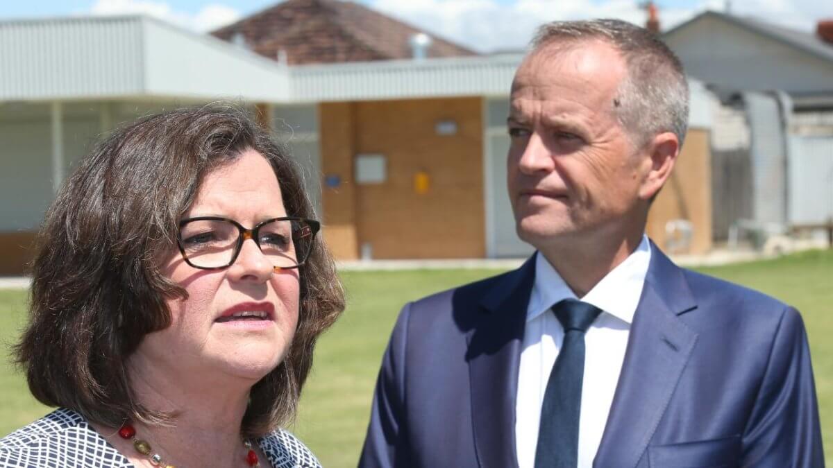 Close up of Ged Kearney and Bill Shorten. Both are looking off into the middle distance in different directions.