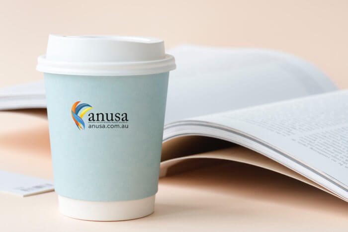 ANUSA logo on coffee cup