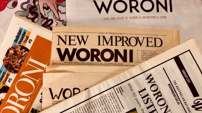 'New Improved Woroni' old headline surrounded by old Woroni newspapers