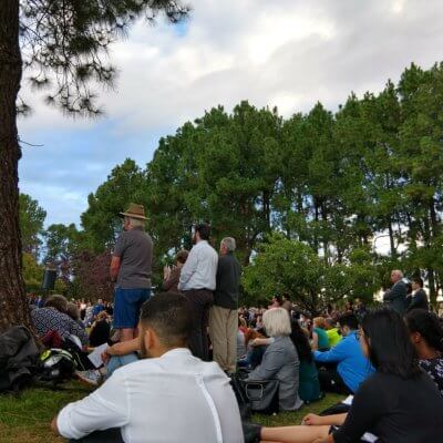 People sit at the vigil for Christchurch victims