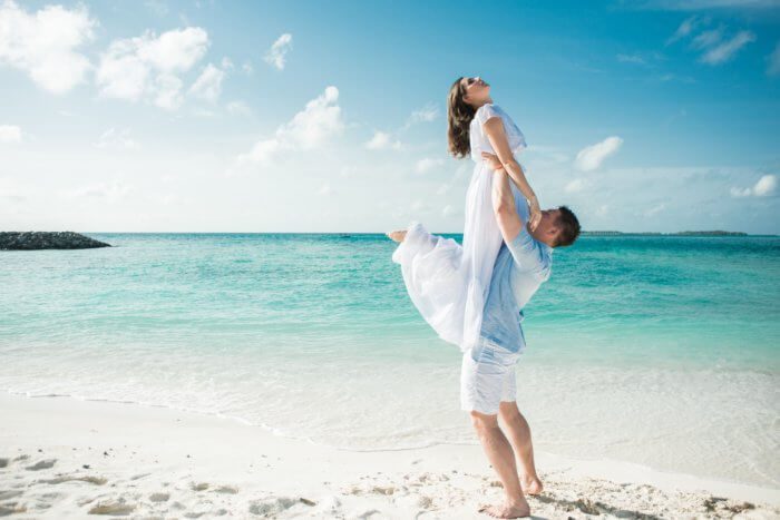 A man and woman on a beach